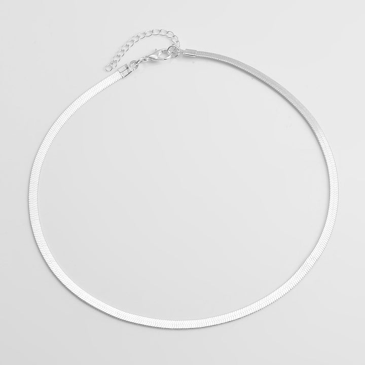 Beautiful women's gold snake chain necklace. Elegant minimalist fashion accessory, ideal for gifting.