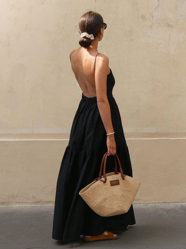 Women's sleeveless backless midi summer dress. Effortless, elegant style for vacation or casual wear.