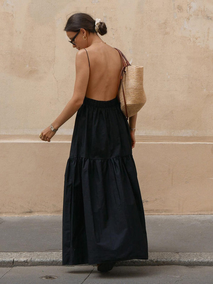 Loose-fit women's midi dress, sleeveless & backless. Perfect casual spring/summer fashion & vacation attire.