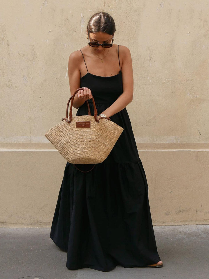 Stylish women's sleeveless backless midi dress. Comfortable loose-fit for summer, spring, and vacation fashion.