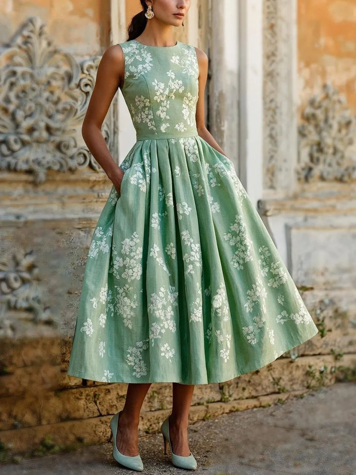 Elegant floral print sleeveless A-line midi dress for women, ideal for spring parties.