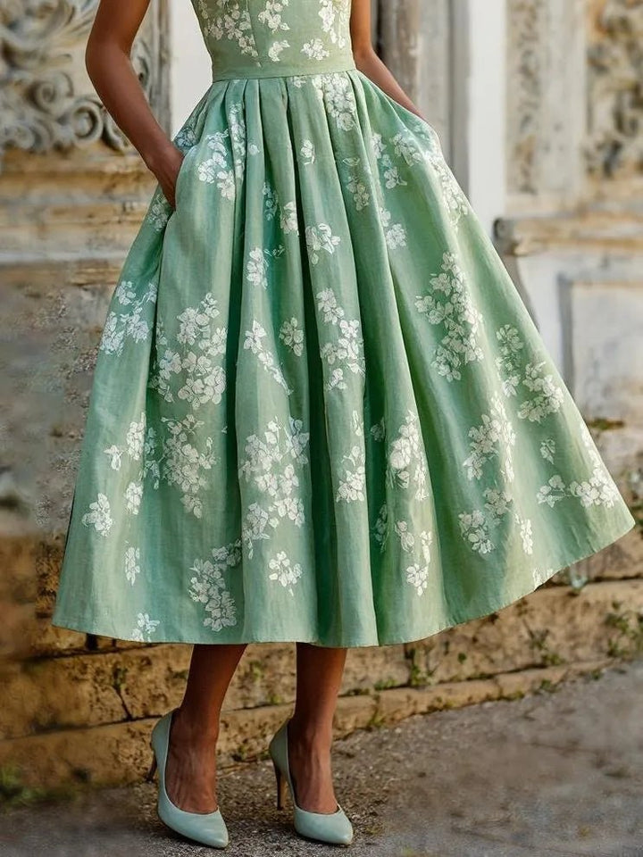 Summer women's sleeveless floral print A-line midi dress, light and breezy vacation wear.