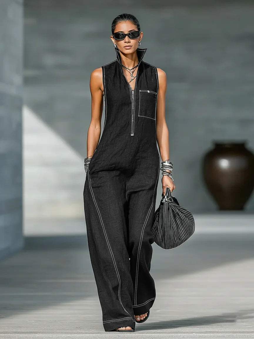 Elegant sleeveless women's jumpsuit featuring sophisticated white trim. Full length with a relaxed fit for summer comfort.
