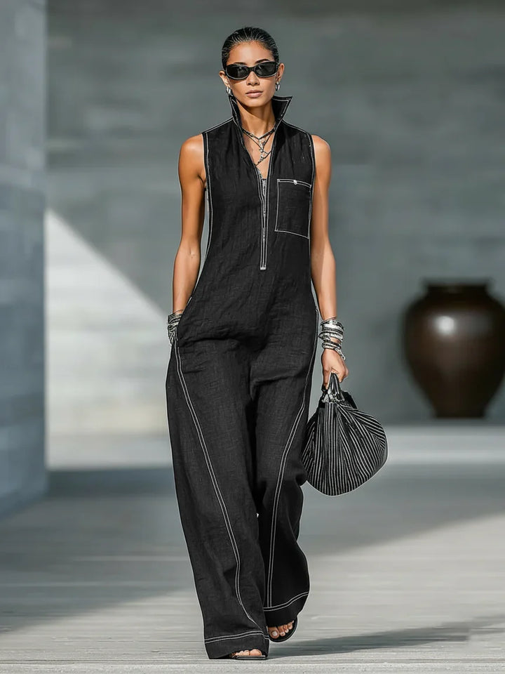 Elegant sleeveless women's jumpsuit featuring sophisticated white trim. Full length with a relaxed fit for summer comfort.