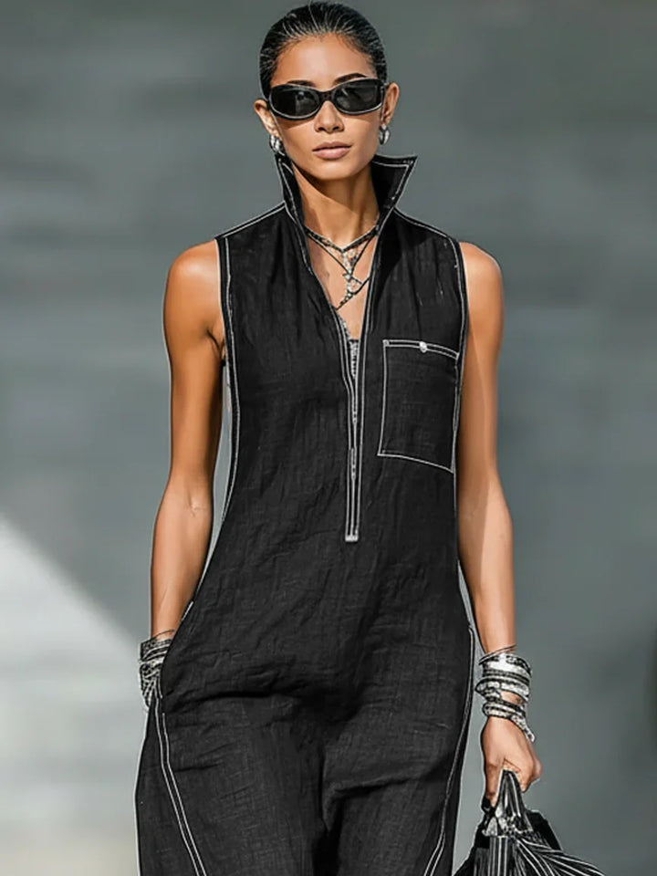 Women's casual elegant sleeveless jumpsuit with striking white trim. Full length and relaxed for summer fashion.
