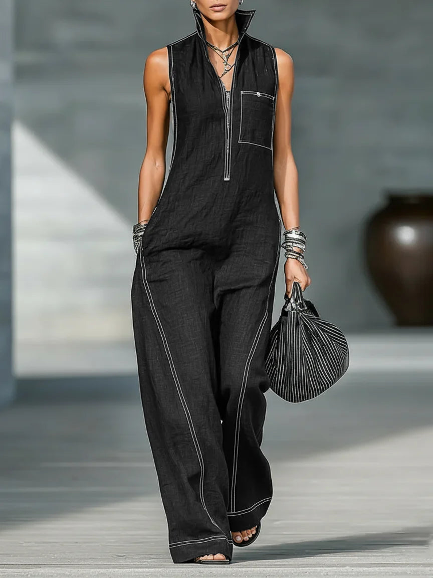 Sleeveless women's jumpsuit with modern white trim. Relaxed, full-length silhouette for a chic and comfortable summer outfit.