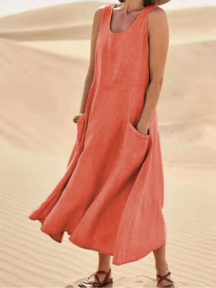 Versatile women's sleeveless maxi dress with pockets. Comfortable for casual everyday wear, beach, or vacation.