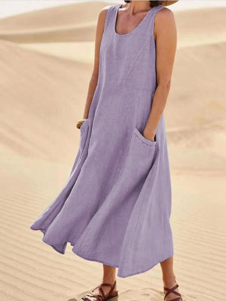 Summer fashion women's sleeveless pocket maxi dress, perfect as a comfortable casual beach or vacation dress.