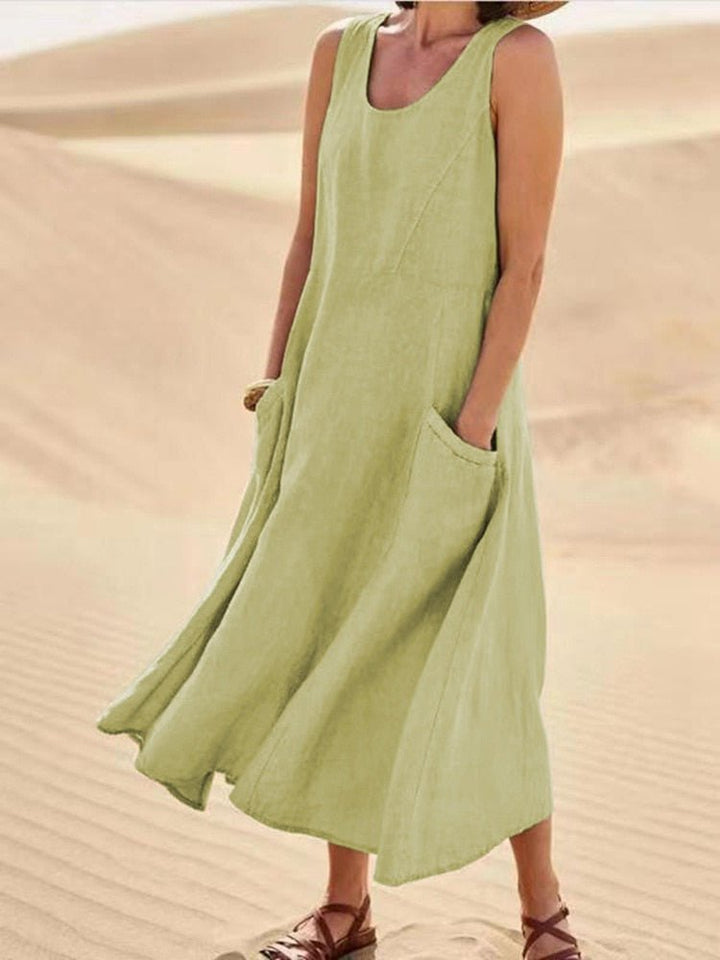 Flowy women's sleeveless pocket maxi dress. A comfortable and versatile casual summer dress for any occasion.