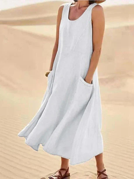 Detail of the soft fabric and practical side pockets on a women's summer midi dress.