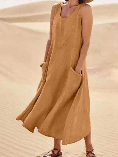Back view of a women's sleeveless midi dress, showcasing its flattering, relaxed fit for summer.