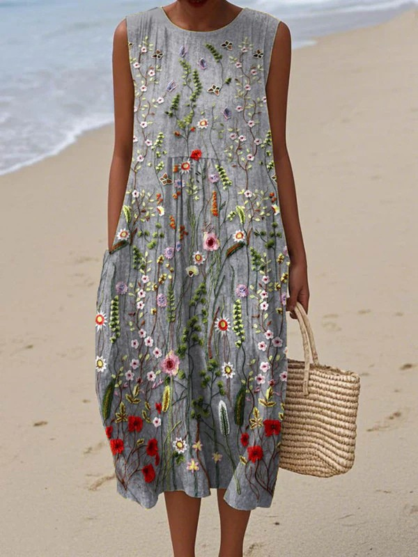 Women's sleeveless midi dress with vibrant wildflower print. Perfect for elegant summer casual wear or spring everyday style.