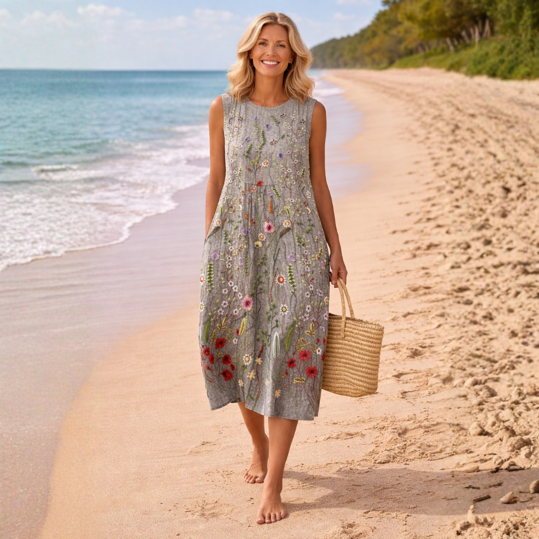 Comfortable women's floral midi dress, sleeveless, featuring a beautiful wildflower print. Versatile for casual spring & summer fashion.