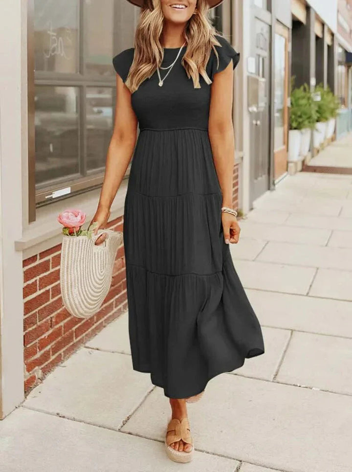 Comfortable smocked sleeveless midi dress for women, designed for sunny summer days.
