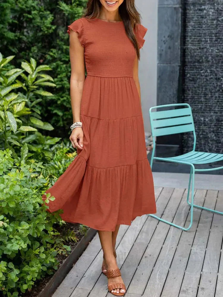 Smocked sleeveless midi dress for women, offering comfortable and chic summer wear.