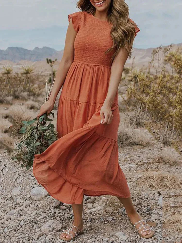 Women's smocked A-line midi dress, perfect for a relaxed yet elegant summer look.