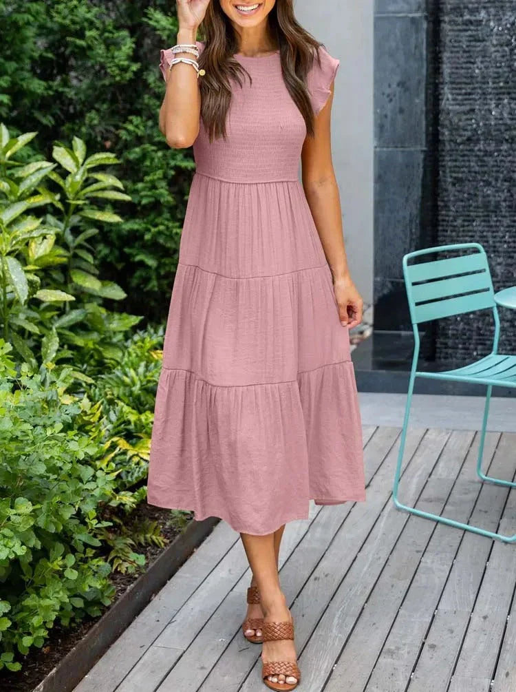 Vacation-ready women's smocked sleeveless midi dress, a breezy summer essential.