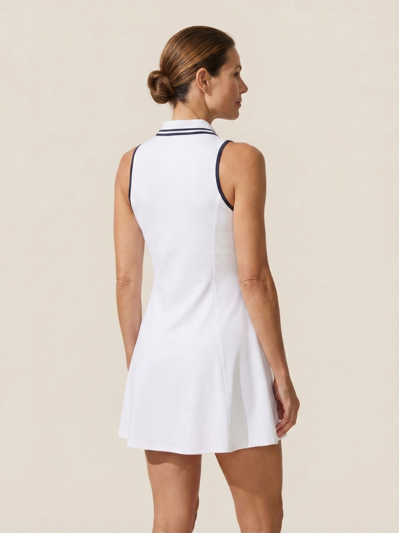 Performance golf dress for women featuring a sleeveless cut & convenient zip collar. Built-in shorts.