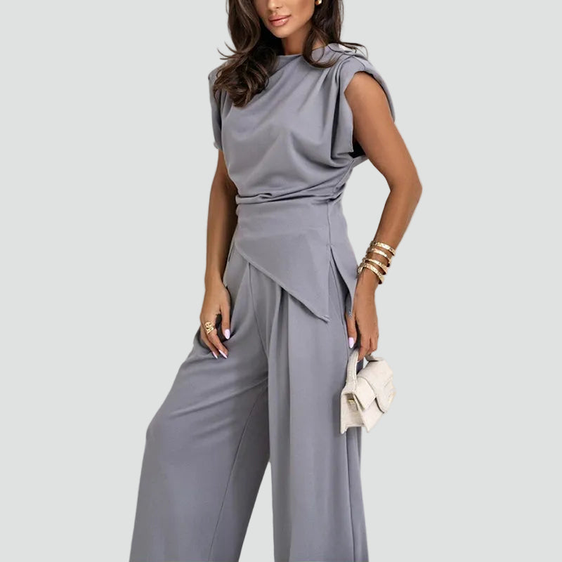 Women's sleeveless two-piece set with wide-leg trousers, perfect for elegant summer wear.