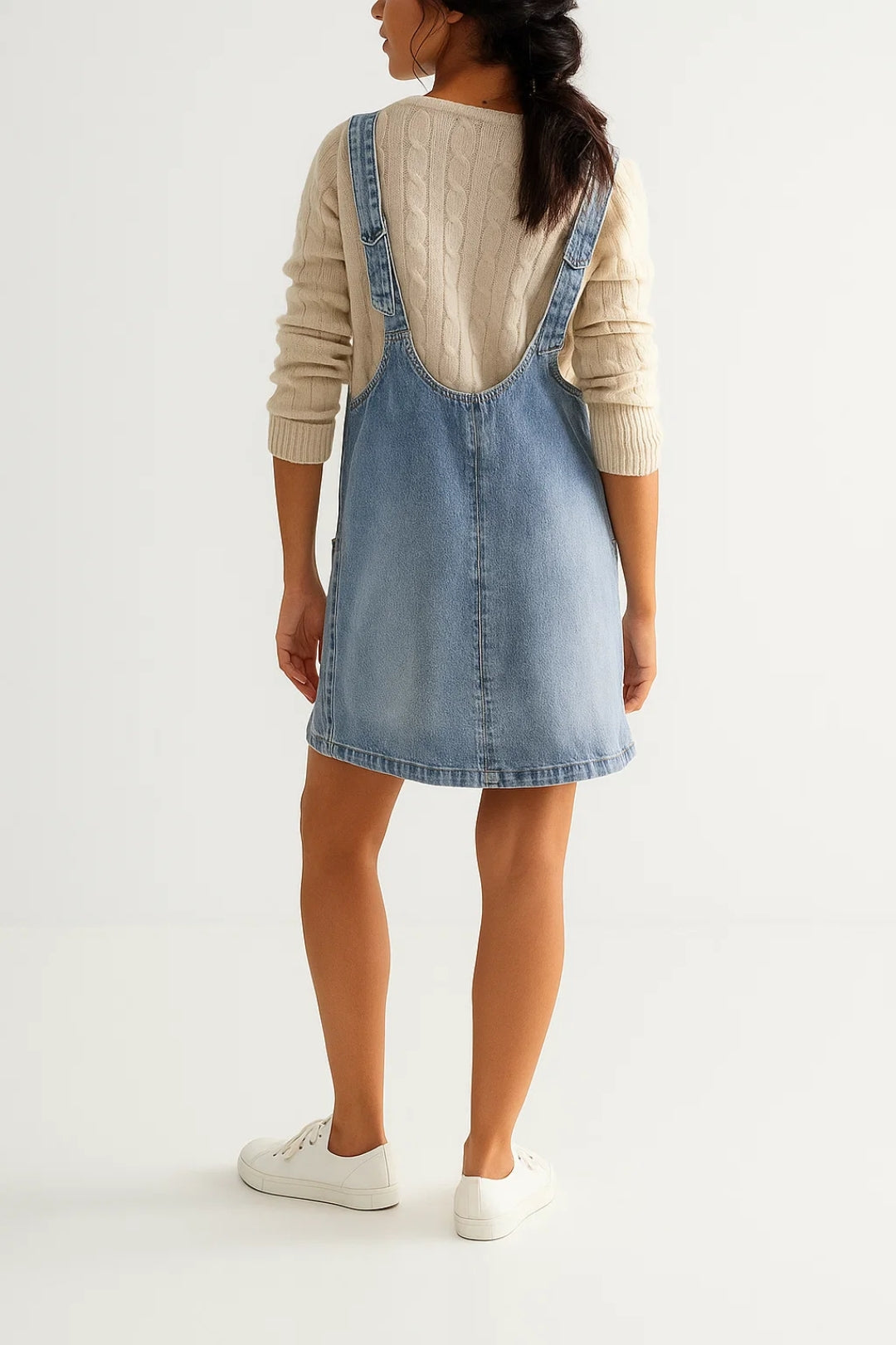 Modern V-neck denim mini dress for women. Sleeveless, versatile style for casual spring, summer & fall fashion.