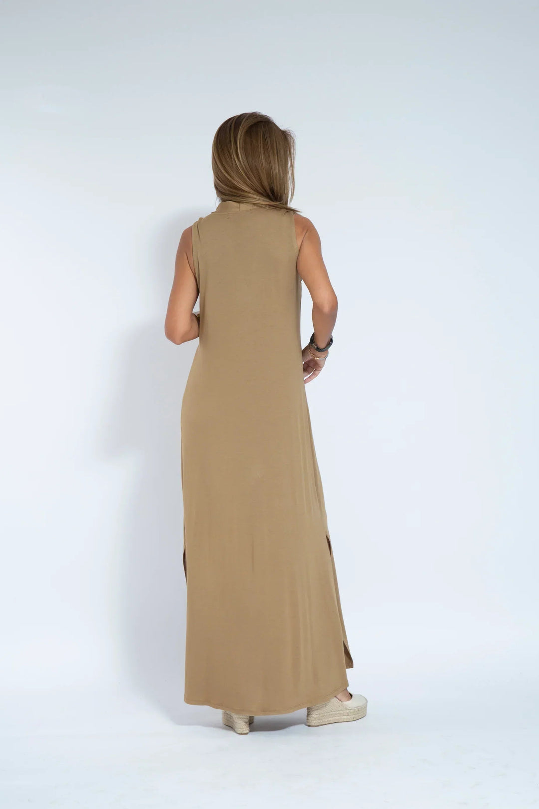 Women's formal V-neck sleeveless maxi evening dress. Flowing design for elegance.