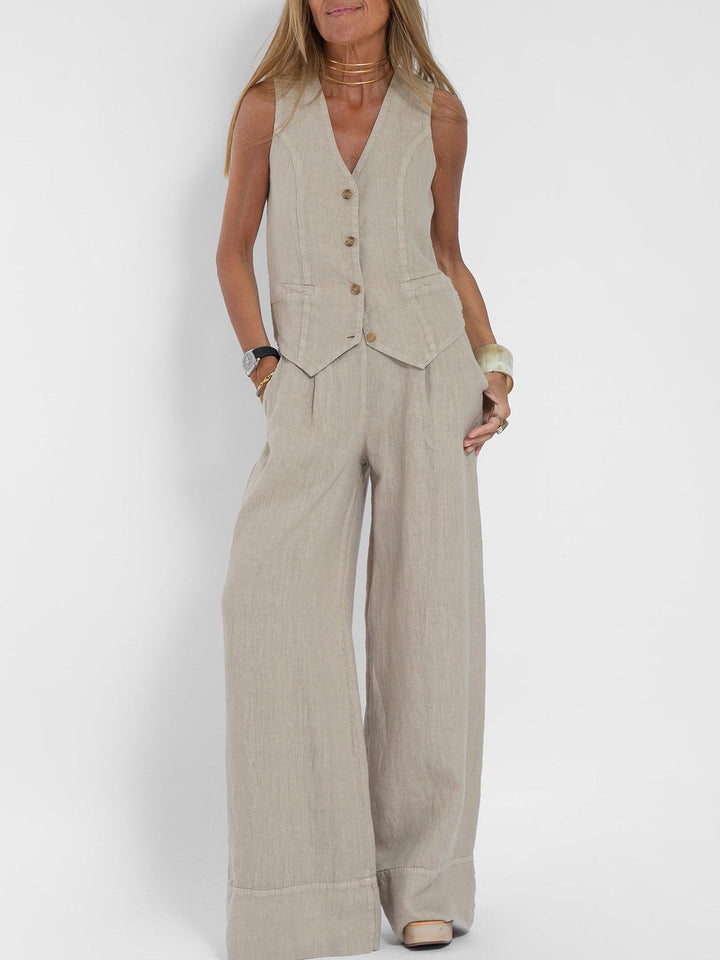 Women's sleeveless V-neck top & wide-leg trouser set, elegant for formal or casual chic wear.