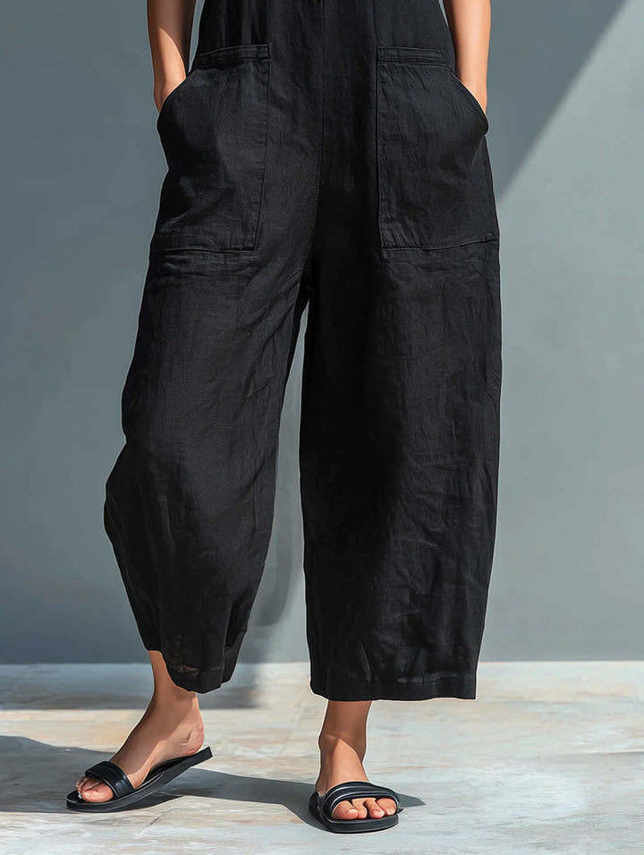 Summer-ready women's sleeveless wide leg jumpsuit with elegant button front detail, chic & breezy.