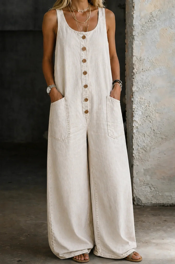 One-piece women's sleeveless jumpsuit with wide legs and button front. Trendy for summer casual clothing.