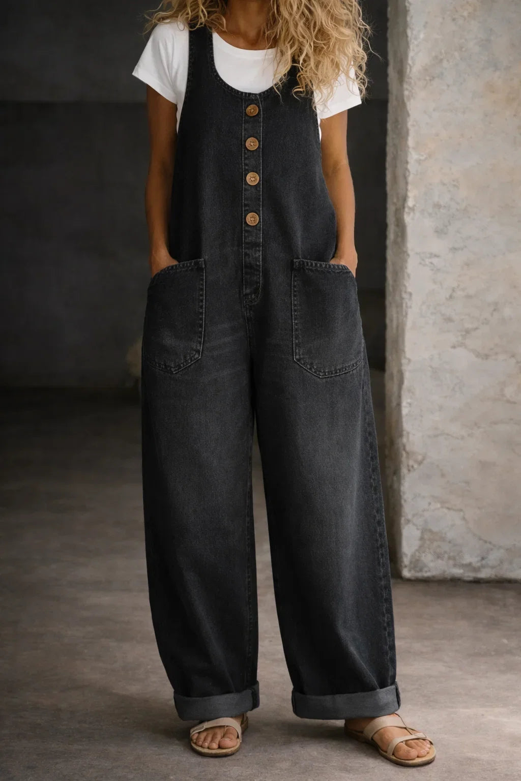 Comfortable sleeveless wide leg jumpsuit for women. Features a chic button front, perfect for summer fashion.