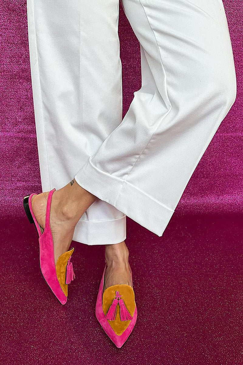 Stylish green women's slingback loafers, featuring a chic pointed toe and playful tassel detail. Comfortable flat dress shoes.
