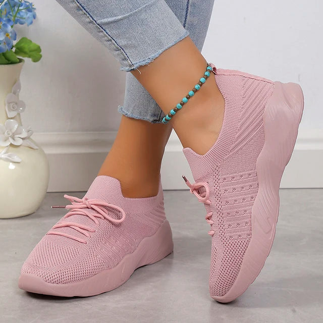 Mesh upper women's slip-on sneakers, ensuring breathability and lightweight comfort.