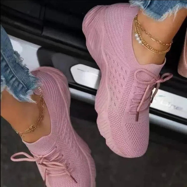 Side view of women's slip-on sneakers, showcasing sleek design and comfortable everyday wear.