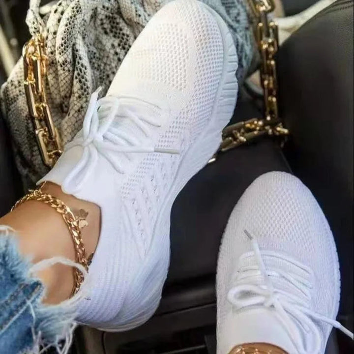 Fashionable women's slip-on sneakers, combining breathability, comfort, and easy-on style.