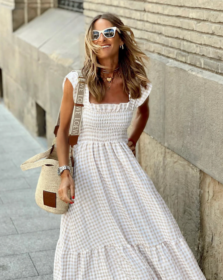 Comfortable women's flowing smocked maxi dress, offering effortless casual summer style.