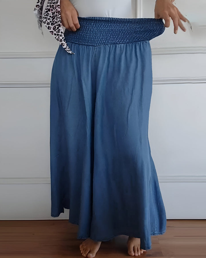 Comfortable women's smocked maxi skirt. Elegant, flowy, & versatile, perfect for casual spring & summer outfits.