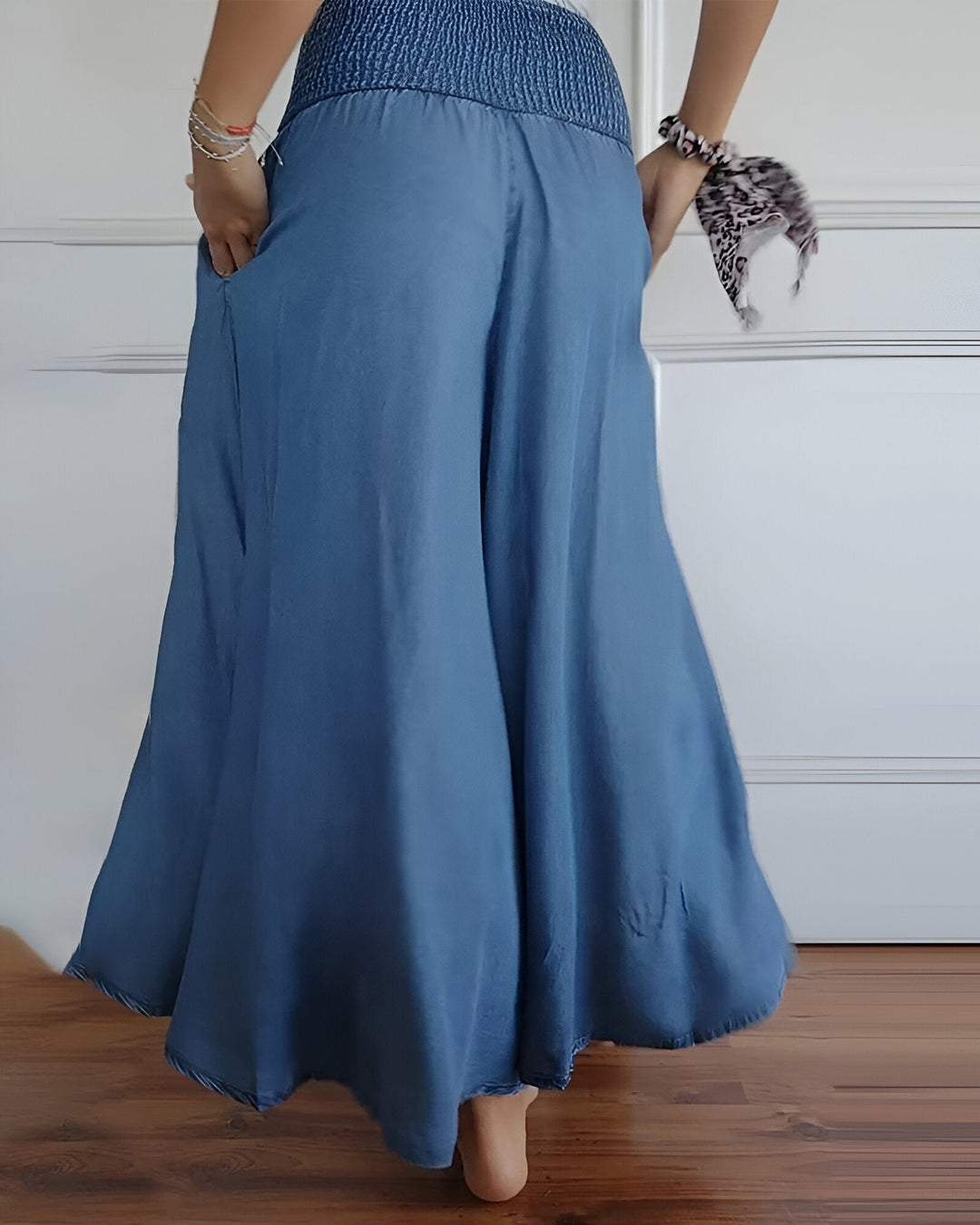 Elegant, flowy women's smocked maxi skirt with wide waistband. Comfortable, versatile long skirt for any season.