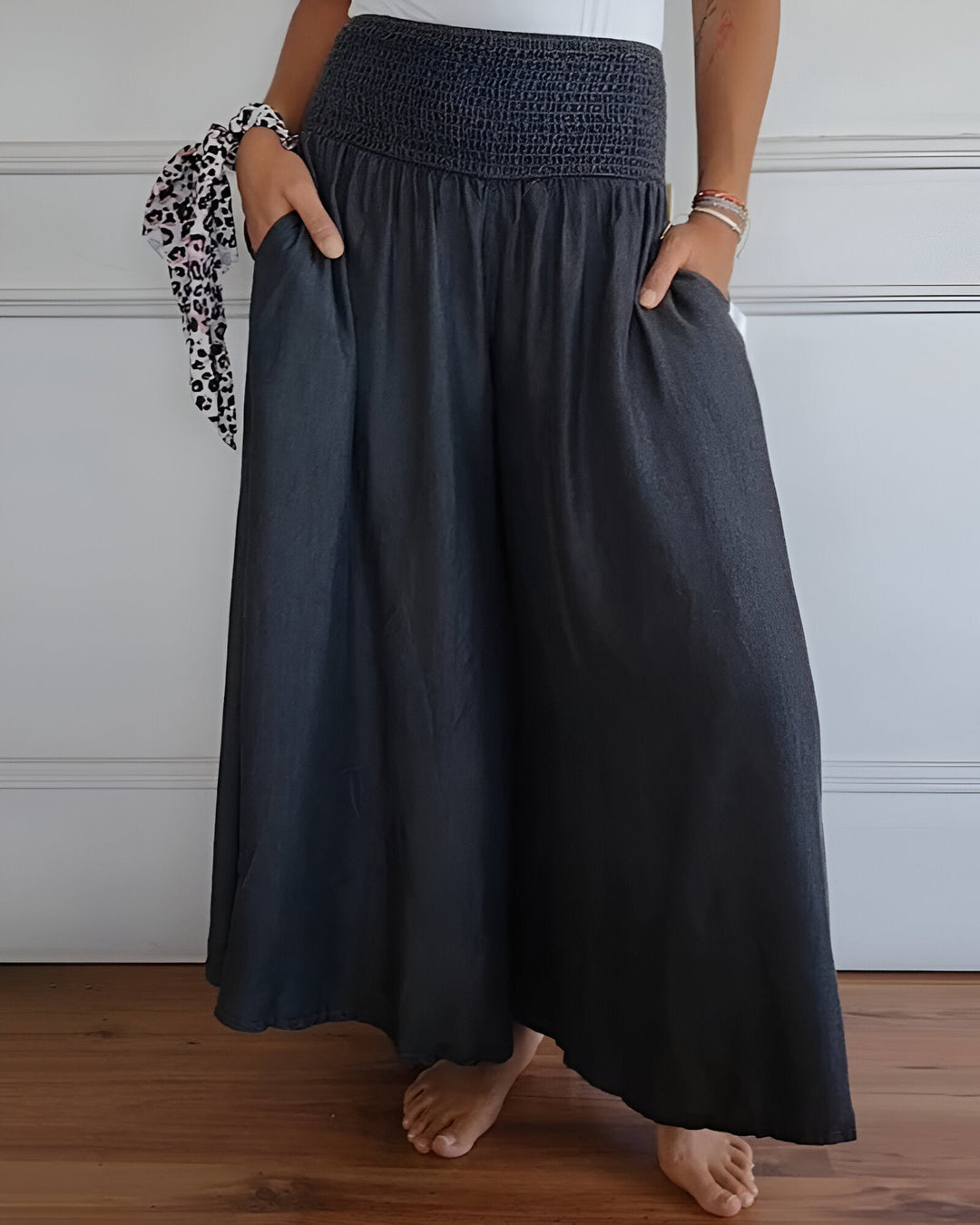 Smocked maxi skirt for women with a wide, comfortable waistband. Flowy long skirt with side pockets for casual wear.