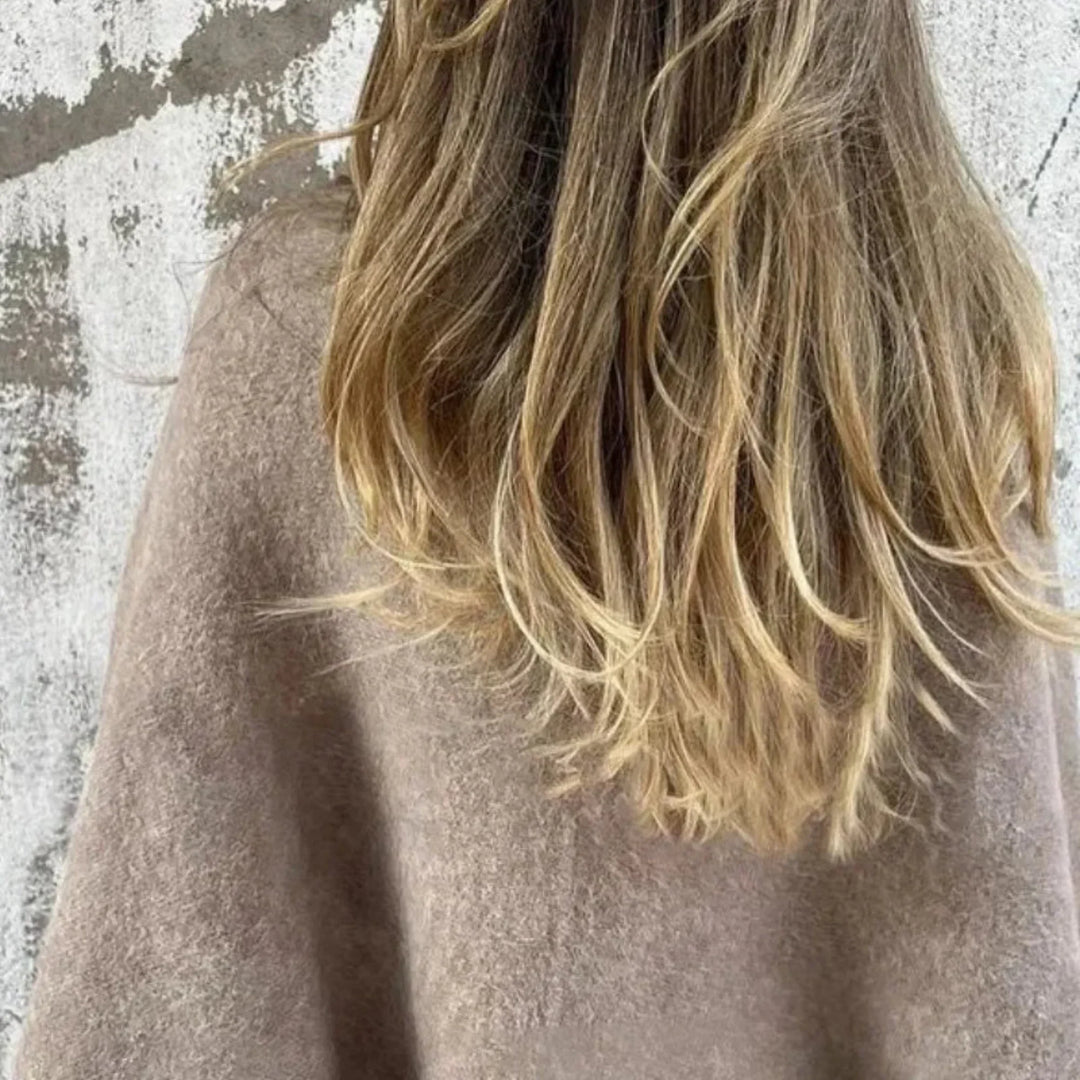 Soft cropped sweater for women, showcasing trendy wide sleeves and an elegant stand collar.