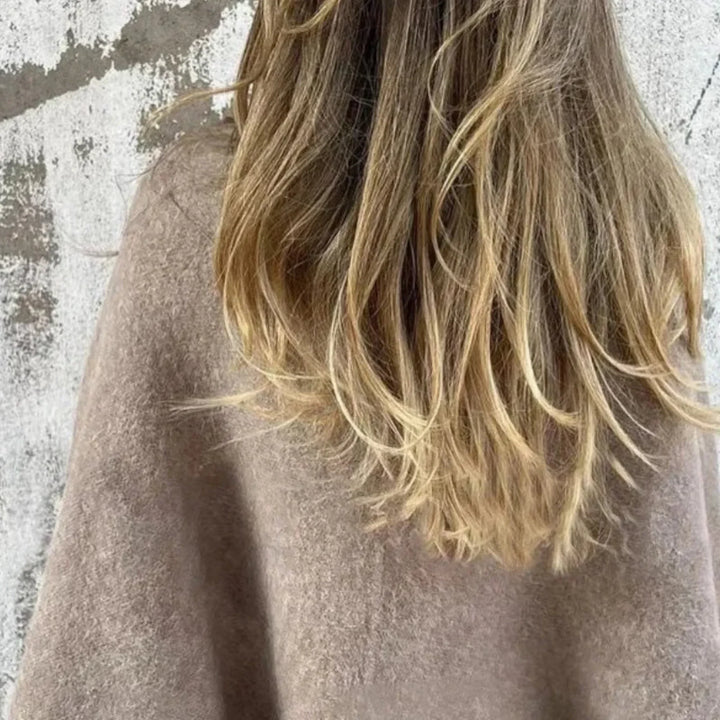 Soft cropped sweater for women, showcasing trendy wide sleeves and an elegant stand collar.
