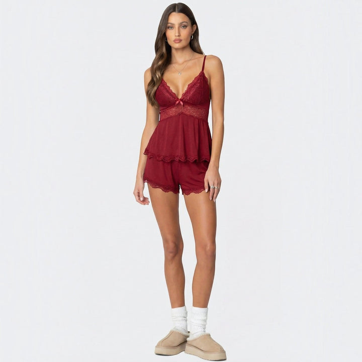 Delicate women's lace trim sleepwear cami set with matching comfortable shorts for elegant nightwear.