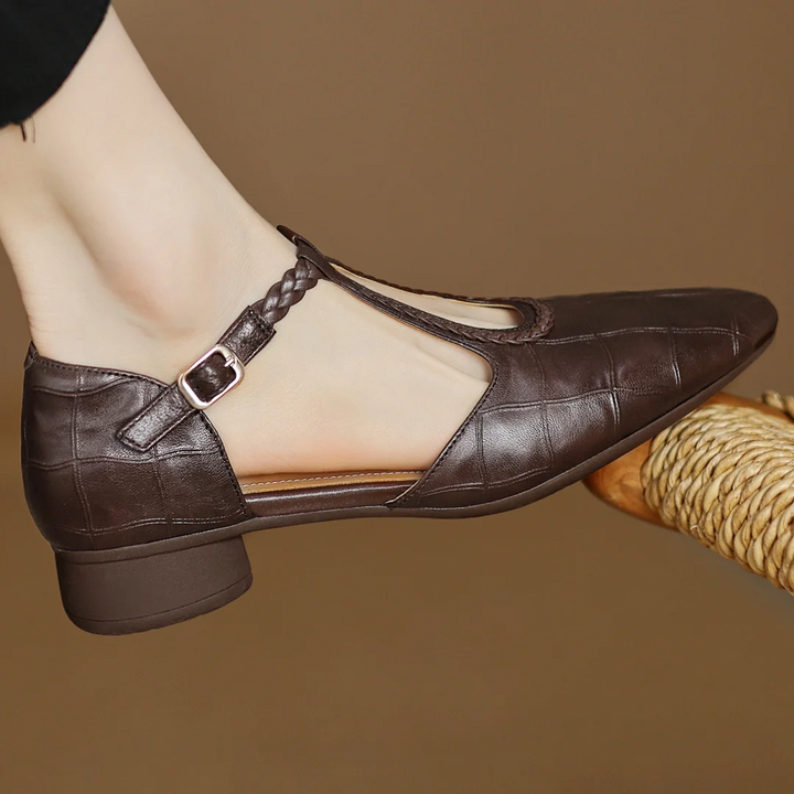 Classic low-heel pointed-toe women's leather Mary Janes with an elegant braided T-strap.