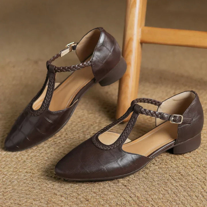Luxurious soft leather women's Mary Janes, showcasing a stylish braided T-strap and low heel.