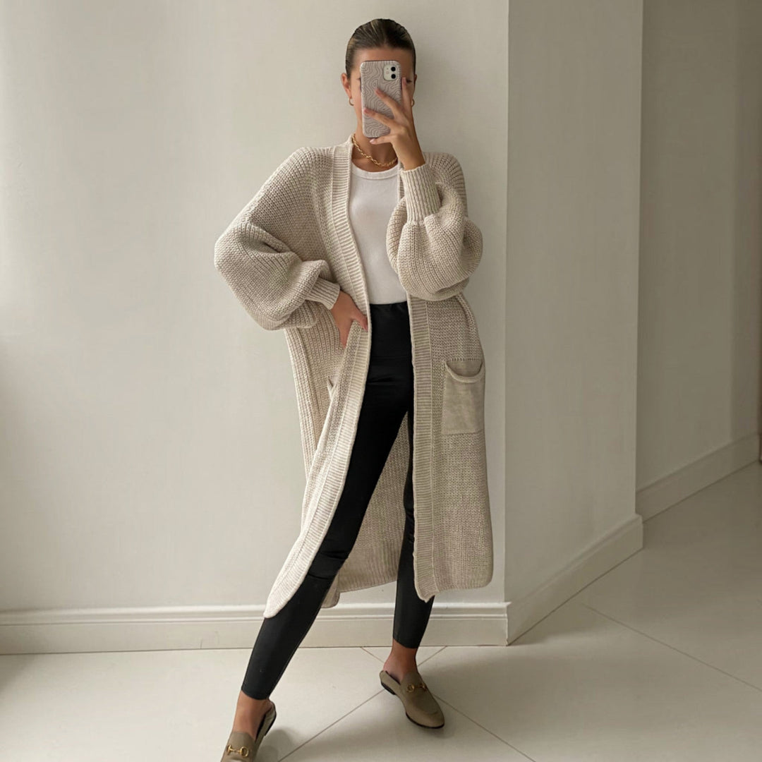 Women's soft longline cardigan with elegant bell sleeves, perfect for versatile everyday layering and fall fashion.