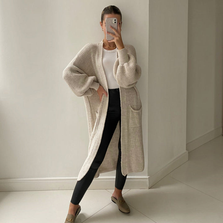 Women's soft longline cardigan with elegant bell sleeves, perfect for versatile everyday layering and fall fashion.