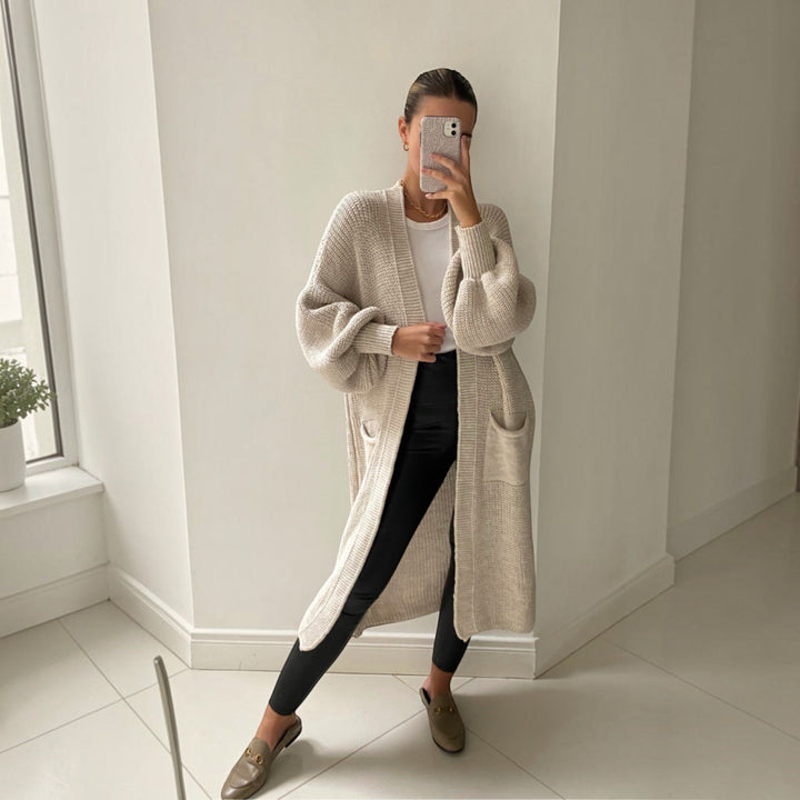 Soft knit women's longline cardigan, an elegant layering piece for chic everyday style. Perfect fall fashion.