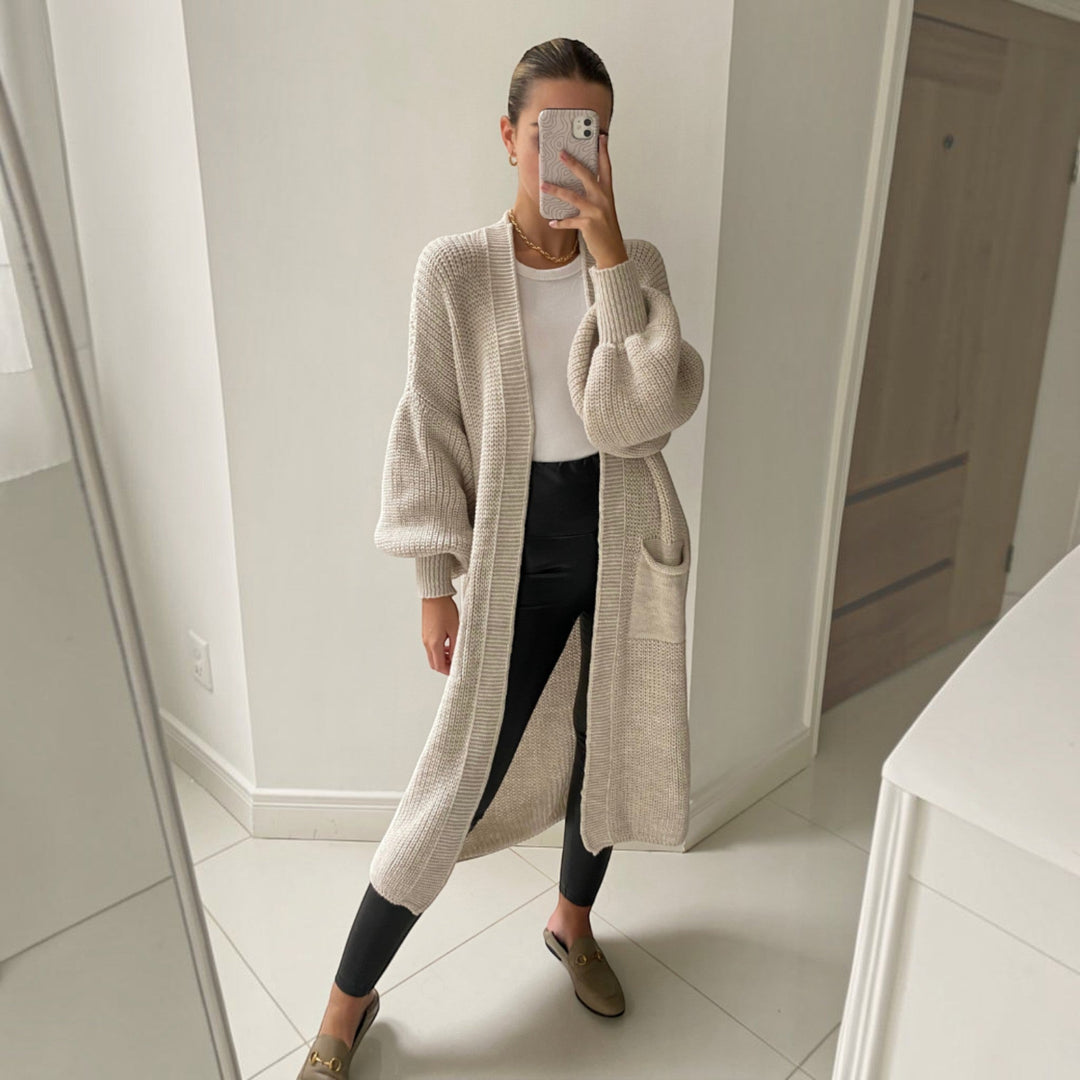 Comfortable women's longline cardigan, soft knitwear with bell sleeves, an essential for chic fall fashion layering.