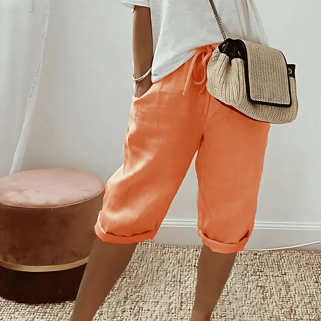 Women's solid color harem knee-length shorts with drawstring waist for comfortable, relaxed summer style.