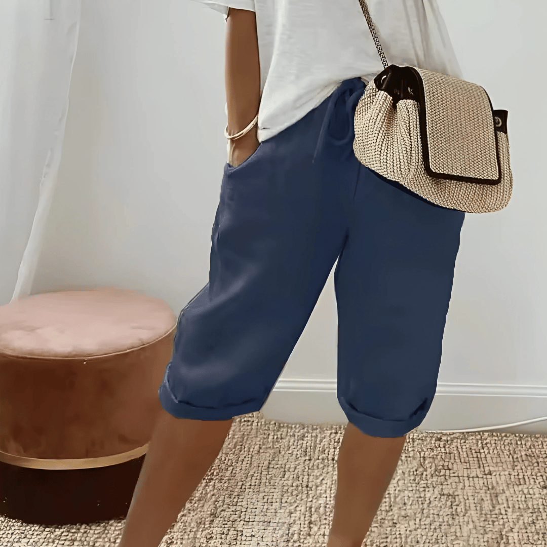 Effortless women's knee-length harem shorts, solid color, high-waist with drawstring, ideal for comfortable summer style.