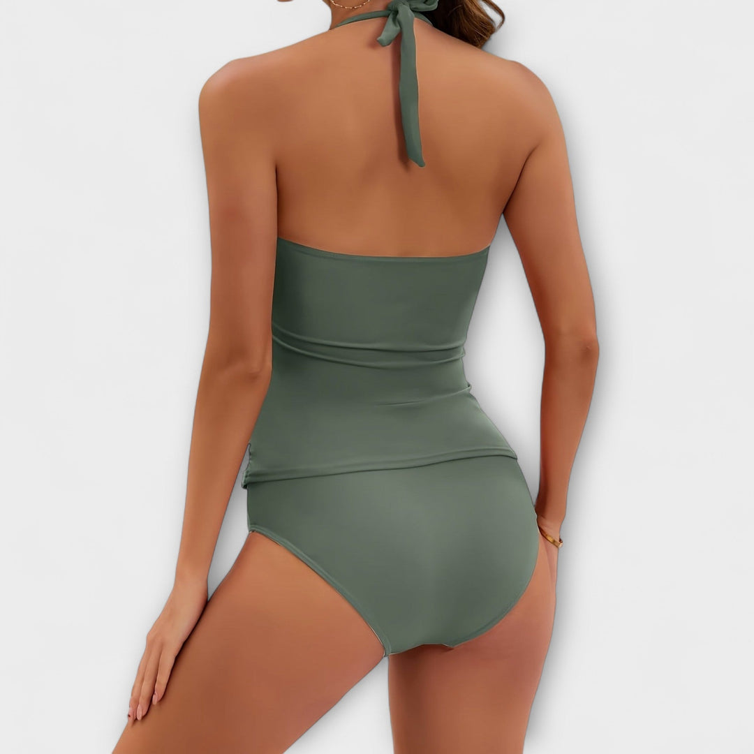 Flattering solid color halter two-piece swimsuit for women. Perfect beachwear & resort style. Summer essential.
