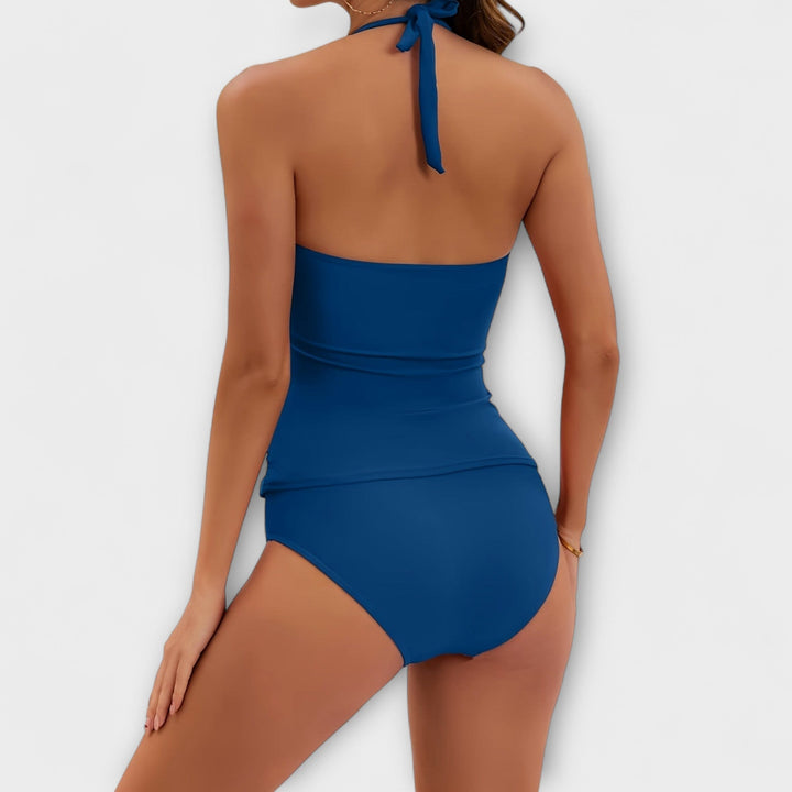 Classic solid color halter two-piece swimsuit for women. Timeless summer fashion & flattering resort wear.